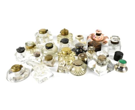 A collection of twenty-seven late 19th/early 20th century inkwells to include a large pewter example, varying size cut glass 