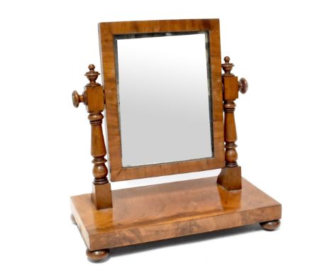 A Victorian mahogany swing toilet mirror, the rectangular mirror plate on turned supports, 51 x 48 x 25cm.