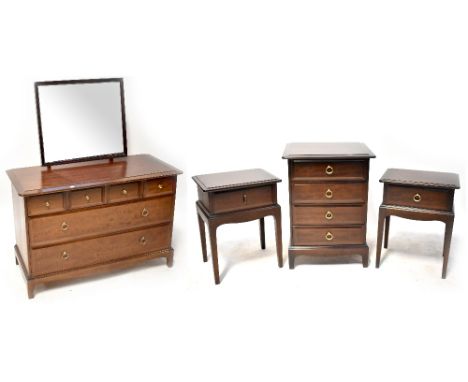 A Stag Minstrel part bedroom suite comprising a dressing chest with attached mirror, 128 x 107 x 47cm, a bedside chest of fou