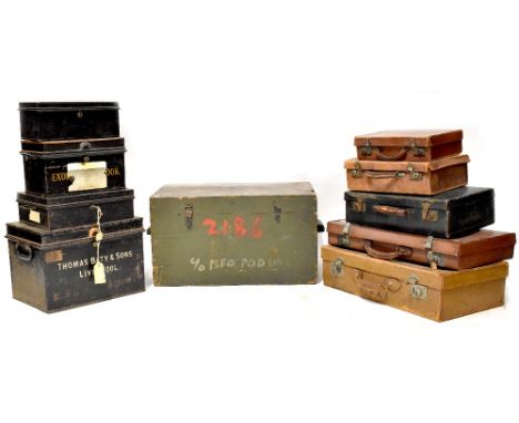 A painted pine trunk with carrying handles, a five vintage leather suitcases, some initialled and four metal document boxes, 