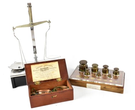 A set of early 20th century W &amp; T Avery apothecary scales on ebonised and white metal base, one drawer containing a small