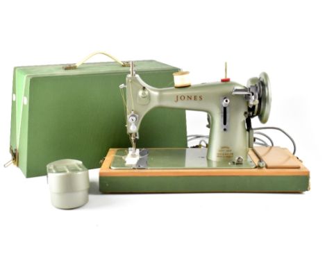 A vintage Jones cased electric sewing machine.