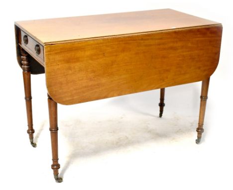 A 19th century mahogany Pembroke table with single frieze drawer opposed by a dummy drawer, on ring turned tapering legs with