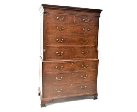 A George III mahogany chest-on-chest, the upper section with cornice above two short and three long graduated drawers with qu