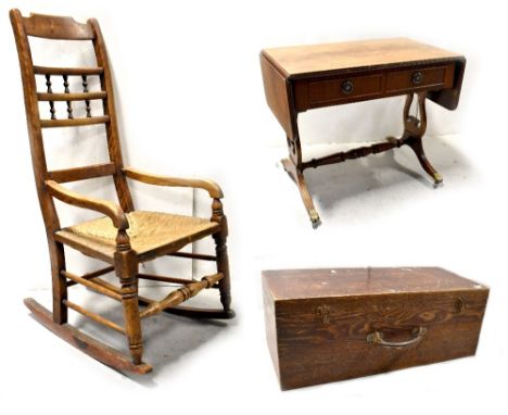 A 19th century country rocking chair, ladder back with turned decoration to outswept arms, ring turned supports and cross-str