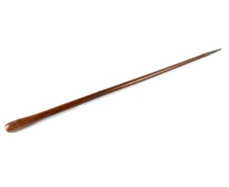 A teak military club stick with tapered metal tip, length 91cm.