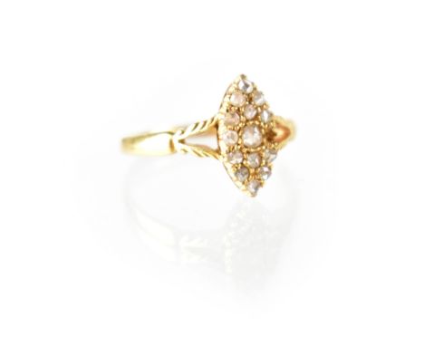 An 18ct yellow gold ladies' dress ring, marquise shape set with fourteen small diamonds, size P, approx 2.7g. CONDITION REPOR