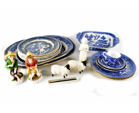 A quantity of late 19th/early 20th century blue and white Willow pattern ware to include large oval serving plates, tureen, s