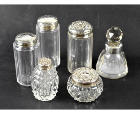 A group of six perfume and trinket pots with hallmarked silver tops and collar, various hallmarks (6).