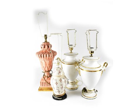 Four decorative ceramic lamps to include a pair of twin-handled Classical-style white ground table lamps with decorative swan