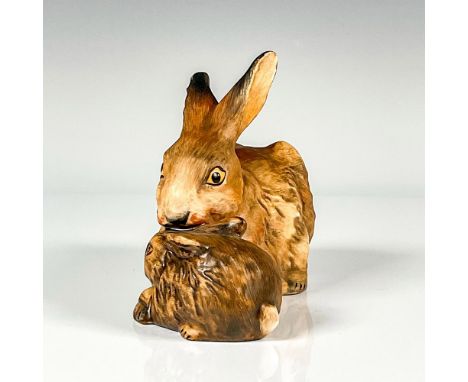 Hand painted in matte finish. modeled as a mother rabbit protecting her baby. Painted in realistic coloration. Goebel backsta