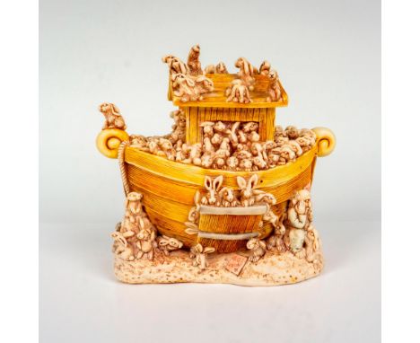 A wooden and ceramic treasure box that depicts an old stranded wooden boat that has been overrun with rabbits that the owner 