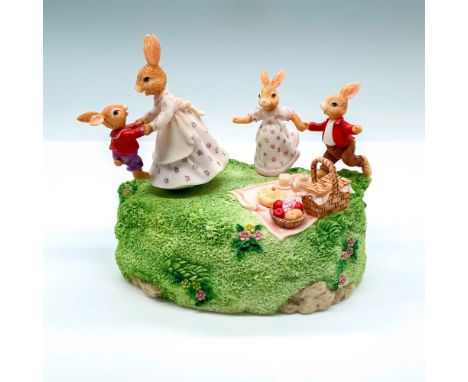 Music box with a Bunnykins family playing on top. Royal Doulton backstamp on bottom. Issued: 1996Dimensions: 5.75"L x 4.25"W 