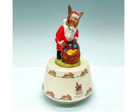 Vintage music box, Plays White Christmas and depicts Santa on top of beige toned porcelain base with design of hoping rabbits