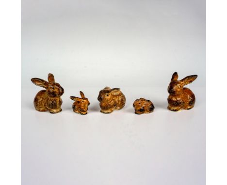 A set of 5 pottery rabbits that are brown in color and decorated with black dots in their design. Japan manufacturing sticker