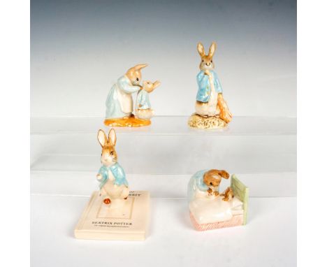 A set of 4 glazed figures depicting Peter Rabbit in various parts of his life. The 3 Royal Albert figures are Peter in bed, P