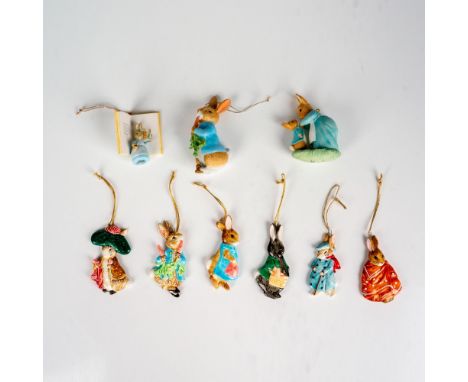 A variety of resin and ceramic Christmas tree ornaments depicting bunny characters. The largest measures 1.25"L x 2"W x 3.5"H