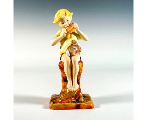 Hand decorated rare figure modeled as a young boy seated playing the pan flute with a bunny sitting on his lap. Hand written 