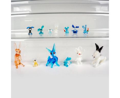 Elevate your decor with a captivating 13-piece set of Murano art glass sculptures featuring an array of meticulously crafted 