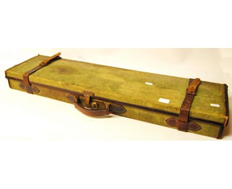Vintage green canvas and leather shotgun case with cleaning kit, lacks label, 82cm long.
