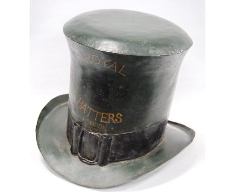 Toleware trade sign in the form of a top hat, inscribed 'Royal Hatters London 1895', no maker's marks, 21cm high.   Condition