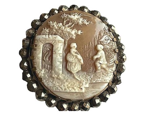 1 large 19th century cut steel bordered shell button. This beautiful example is finely carved with incredible detail of the p