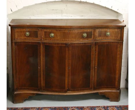A mahogany serpentine sideboard crossbanded and strung with fruitwood and raised on bracket feet.