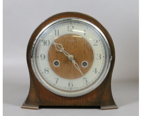 An oak cased Smith Enfield mantel clock, chiming on a coiled gong.