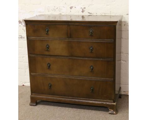 A mahogany two over three chest of graduated drawers raised on bracket feet.