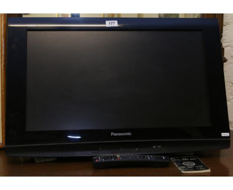 A Panasonic TX26LXD80 flatscreen television with wall mounting bracket and remote control.