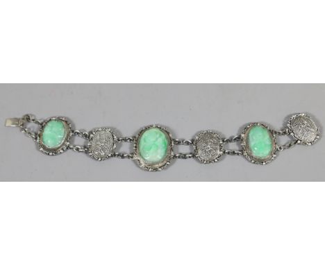 A silver filigree and jadeite Chinese silver bracelet. Condition Report. To be used as a guide only. Jade in good condition. 
