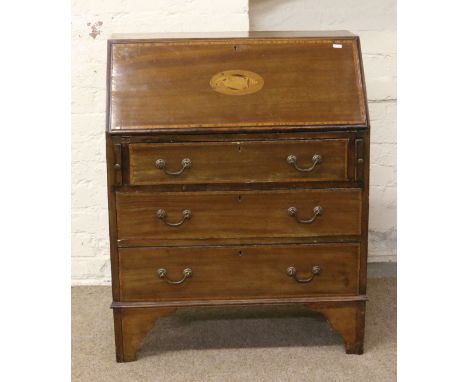 A Victorian inlaid mahogany fallfront bureau over three graduated drawers raised on bracket feet.