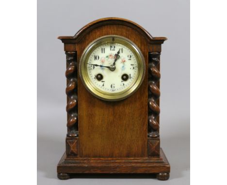 An oak cased Japy Freres eight day mantel clock, half hourly chiming on a bell.