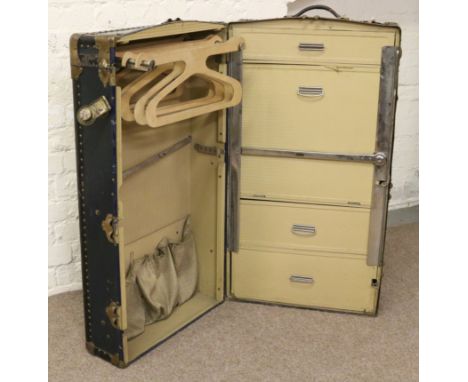 A metal bound steamer trunk and keys with fully fitted interior bearing label Wata Joy, London Made and Patent No 431080.