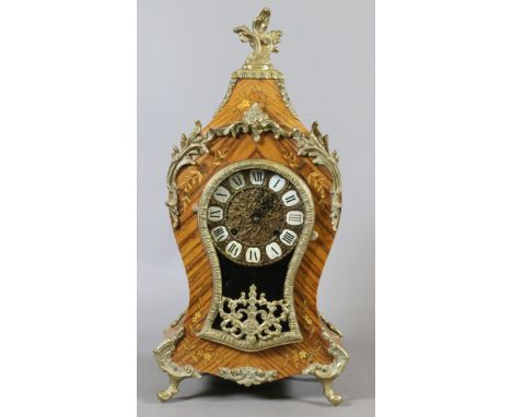 A German eight day bracket clock in marquetry inlaid kingwood case and with gilt metal mount and striking half hourly on a be