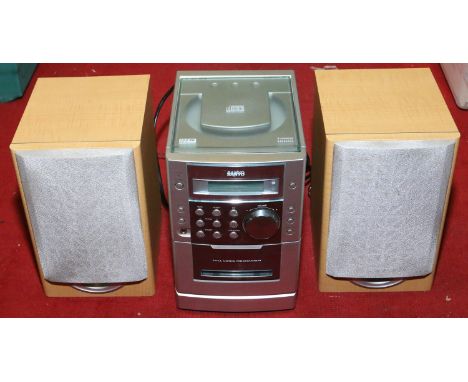 A compact disc and tape player with matching speakers.