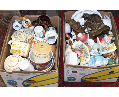 Two boxes of mixed china and ornaments to include storage jars and ceramic book end etc.