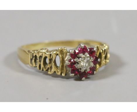 An 18ct gold ruby and diamond cluster ring, size K, 3.0 grams.