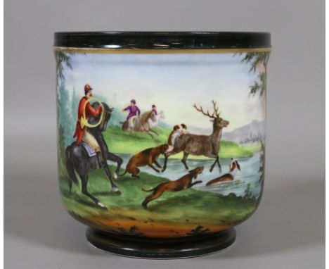A C19th Paris porcelain cache pot hand painted in coloured enamels with a stag hunting scene.