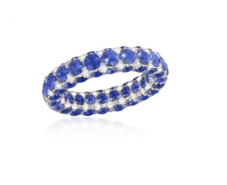 LANGI: A SAPPHIRE AND DIAMOND ETERNITY RINGComposed of a continuous row of circular-cut sapphires, accented with brilliant-cu