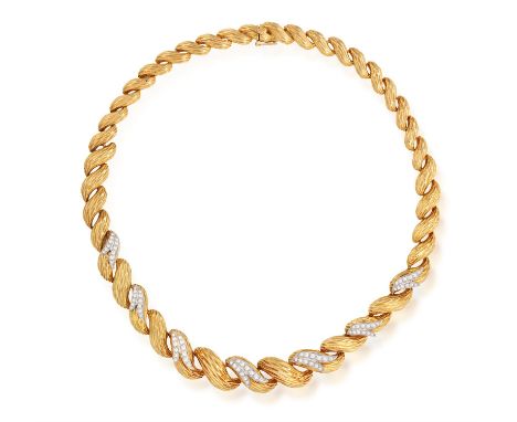 KUTCHINSKY: A DIAMOND NECKLACE, 1963Of articulated textured gold design, the frontispiece highlighted with a series of brilli