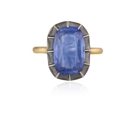 A SAPPHIRE DRESS RINGOf Georgian style, the elongated cushion-shaped sapphire weighing 6.42cts, within a multiple-claw settin