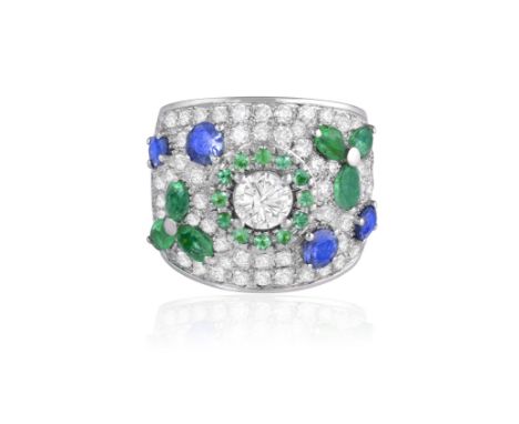 A DIAMOND AND GEM-SET DRESS RINGThe wide band centring a brilliant-cut diamond weighing approximately 0.60ct, within a circul
