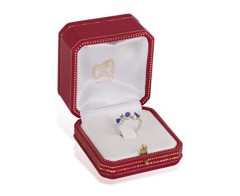 CARTIER: A SAPPHIRE AND DIAMOND 'MÉLI MÉLO' RING, CIRCA 2002The knife-wire band set with marquise and oval-shaped sapphires a