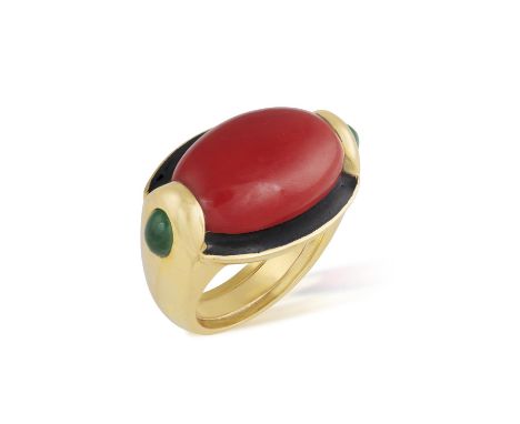 A CORAL, EMERALD AND ENAMEL COCKTAIL RINGThe horizontal oval-shaped mount set with an oval-shaped coral corallium rubrum cabo