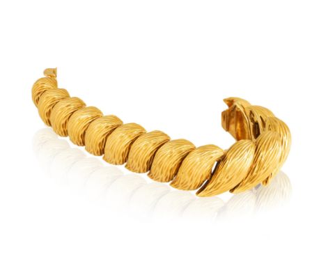 KUTCHINSKY: A GOLD BRACELET, 1963Designed as a coil of textured gold links with flattened backs, in 18K gold, with maker's ma