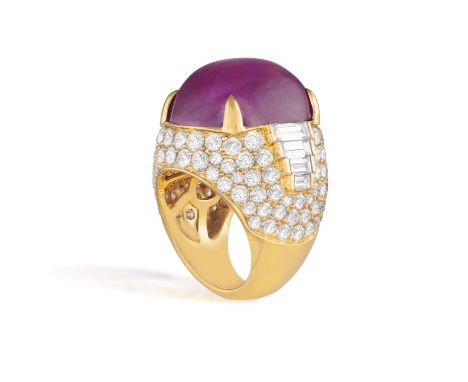 BULGARI: AN IMPORTANT RUBY AND DIAMOND DRESS RINGComposed of a cushion-shaped cabochon ruby, within a four-claw setting, to b