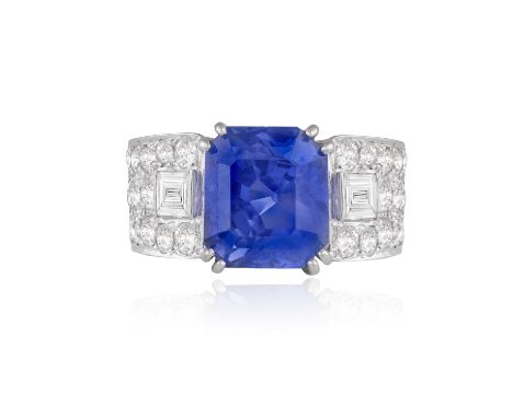 AN ART DECO SAPPHIRE AND DIAMOND DRESS RINGThe rectangular cut-cornered sapphire weighing approximately 7.36cts, within a dou