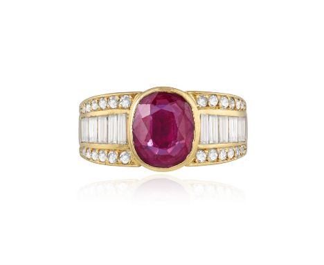 A RUBY AND DIAMOND DRESS RINGThe oval-shaped ruby 1.50cts within collet-setting, between graduated baguette-cut shoulders, wi