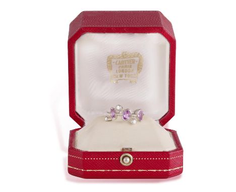 CARTIER: A PINK SAPPHIRE AND DIAMOND 'MÉLI MÉLO' RING, CIRCA 2002The knife-wire band set with marquise, oval and pear-shaped 